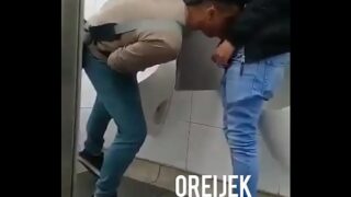 Random Latin dudes hook up for a blowjob in public restroom