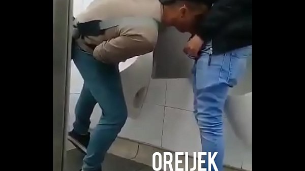Random Latin dudes hook up for a blowjob in public restroom